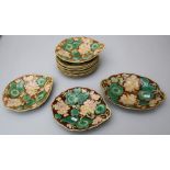 Eight 19th century continental majolica 22cm diameter plates, each florally decorated in shallow