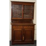 An Edwardian mahogany side cabinet, the upper height enclosed by a pair of astragal glazed doors