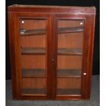A Victorian mahogany bookcase, the pair of glazed doors enclosing three adjustable shelves, on