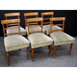 A set of six early 19th century mahogany dining chairs, each having fielded rail, reeded