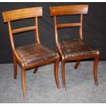 A set of six William IV mahogany dining chairs, the curved cresting rail over slip in seats on sabre