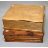 A craftsman built light oak collectors chest, the undulating adzed top rising to reveal a twelve