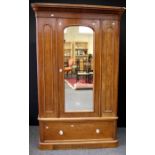 A Victorian mahogany single wardrobe, with moulded cornice over full length mirror door, the base