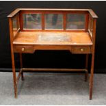An Edwardian mahogany writing desk, the superstructure with mirror and glazed panels over a