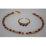 A 9ct gold tennis type bracelet set with ten cushion cut rubies and diamond chips with pierced