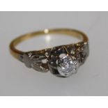A single stone diamond ring, the 3mm (approx.) diameter stone, illusion set, on an 18ct gold and