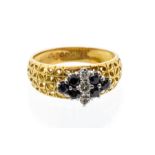 A sapphire and diamond 18ct gold ring, comprising a cluster set with a central row of round