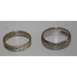 An 18ct white gold floral engraved wedding band and a 9ct wedding band. 5.4g or 2.5g respectively