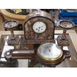 An Edwardian marble clock and a pair of garnitures; and an oak wheel barometer