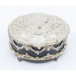 An early 20th Century Continental white metal and tortoiseshell oval box and cover, the cover