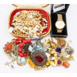 A collection of costume jewellery to include a silver Edwardian mother of pearl and enamel brooch