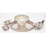 A Victorian style plated large punch bowl with lion's head and ring handles, weighted together