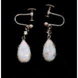A pair of early 20th Century opal and white sapphire white metal drop earrings, comprising claw