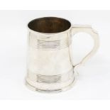 A Victorian silver tapering tankard, with reeded decoration, C-scroll handle, 1876, 11.77 ozt (366.2