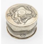 An early 19th Century Chinese Export silver circular box and cover, the body and cover chased with a