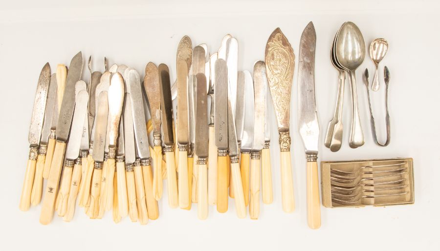 A collection of Victorian large steel and ivory handled table knives, the handles stamped with