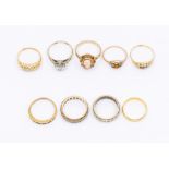 A collection of gold rings to include a 22ct gold wedding band, size L, weight approx. 2.5gms, two