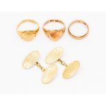 A collection of three 9ct gold rings to include a rose gold shield shaped signet ring size Q, a