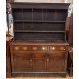 18th Century oak kitchen dresser with plate rack, three top drawers over two cupboard, doors, on