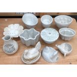 A collection of creamware ceramic kitchen items to include:- six jelly moulds, a Royal Winton 'Dr.