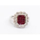 A ruby and diamond 18ct white gold cluster ring, the checker board centre set with five rows of