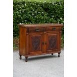 A late Victorian mahogany chiffonier, circa 1890, comprising two short drawers over two cupboard