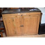 A Victorian pine kitchen floor standing food cupboard, with two shelves behind two cupboard doors