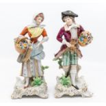 A pair of early 20th Century figures of flower and game sellers