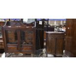 Two early 20th Century oak smokers cabinets, with pipes