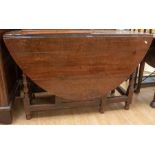 A late 17th Century early 18th Century oak gate leg table, plank top, two drop down leaves, turned