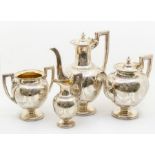 A Victorian Aesthetic silver four piece tea and coffee service comprising teapot, coffee pot, milk