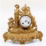 A late 19th Century French spelter and gilt mantle clock, Roman numerals, to a white enamelled