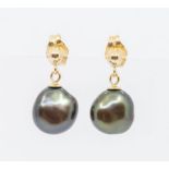 A pair of 9ct gold and black fresh water pearl drop earrings, pearls approx. 7mm, with bead and peg,