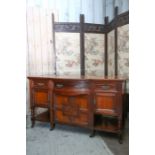 A Victorian Aesthetic period walnut sideboard, fitted with three drawers, the centre bow fronted,