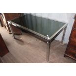 A contemporary Italian extending chrome framed, reflective glass inset dining table with square