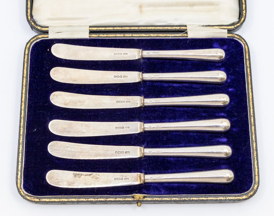 A set of six George V silver butter knives, blades and handles marked Sheffield, 1914, in fitted