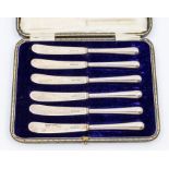 A set of six George V silver butter knives, blades and handles marked Sheffield, 1914, in fitted