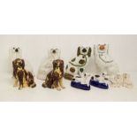 A pair of Staffordshire pottery dogs, another pair with treacle glaze, a Beswick pair, a pair of