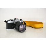 A vintage Nikon FM2 35mm camera with Vivitar 35-105mm, 3.2-4 lens.  A beautiful example of this
