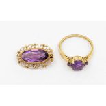 A 9ct gold amethyst ring, comprising a claw set amethyst with small brilliant cut diamonds and