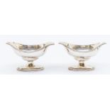 A pair of George III silver oval double lipped salts on raised feet, London, 1784, maker's mark