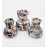 Five 19th century Mason Jugs, the largest with an Asian design the other with an Imari design, of