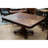 An early Victorian mahogany tilt-top breakfast table, the rectangular top raised on an octagonal