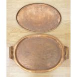 A Birmingham Guild of Handicrafts oval copper twin-handled tray, stamped marks, 56cm long, another