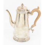 A Georgian style silver plain tapering coffee pot, fruitwood handle, hallmarked by C F Hancock &