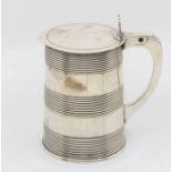 A George III silver tapering barrel style tankard and cover, the plain cover engraved with Arms