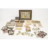 A box of assorted cigarette cards and albums, mostly early 20th Century, also including a collection