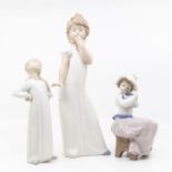 Lladro figure of a girl along with two Nao figures of young girls