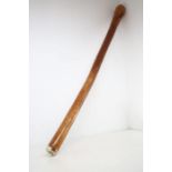 A plain wooden didgeridoo