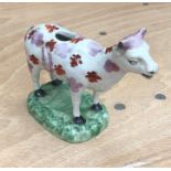 A Swansea cow creamer, with a fair amount of damage, tails broken and missing, no lid and the